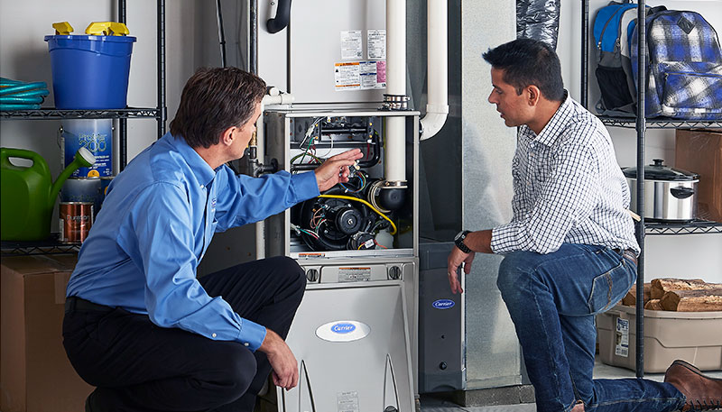 Technician evaluating a furnace for repair or replacement in Stevenson Ranch