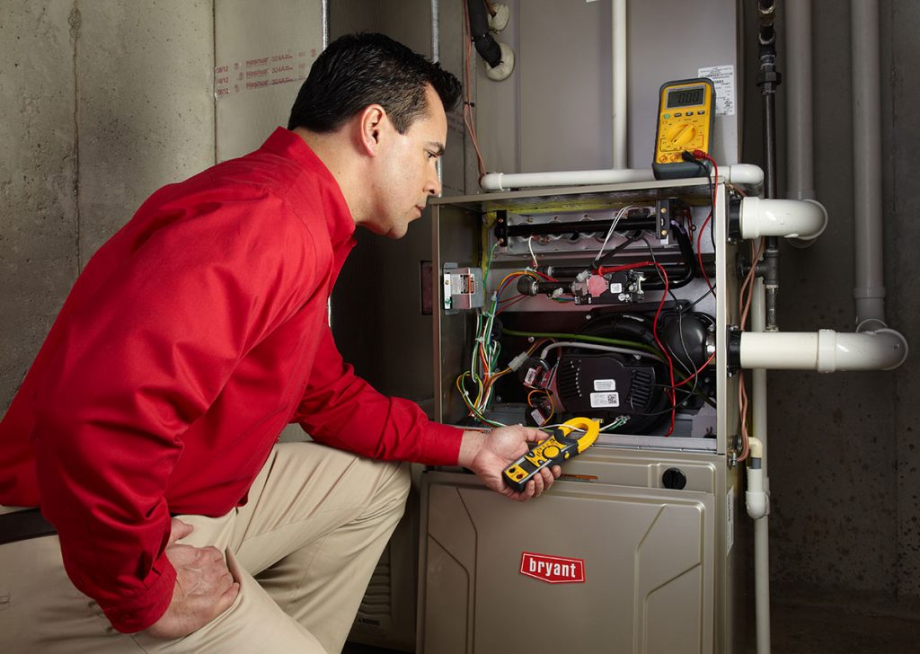 Heating technician diagnosing a furnace repair in Stevenson Ranch