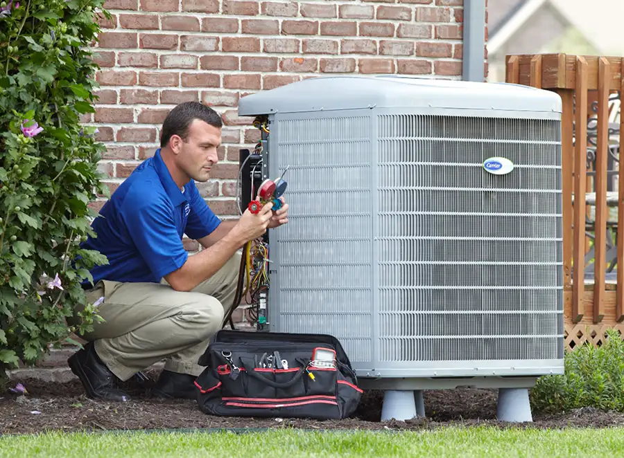 HVAC technician inspecting an outdoor AC unit in Stevenson Ranch