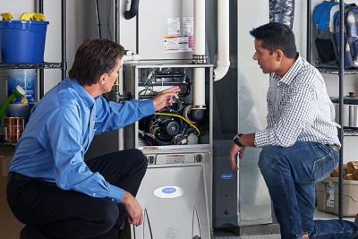 Technician evaluating a furnace for repair or replacement in Stevenson Ranch