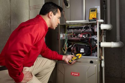 Heating technician diagnosing a furnace repair in Stevenson Ranch